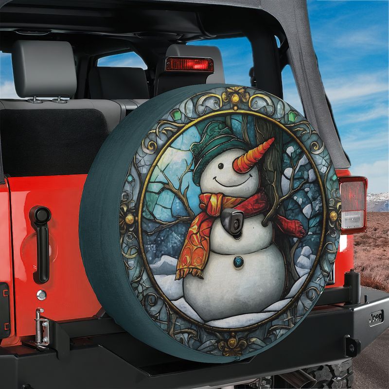 Teal Jeep Wrangler displaying stained glass snowman spare tire cover with rear backup camera hole