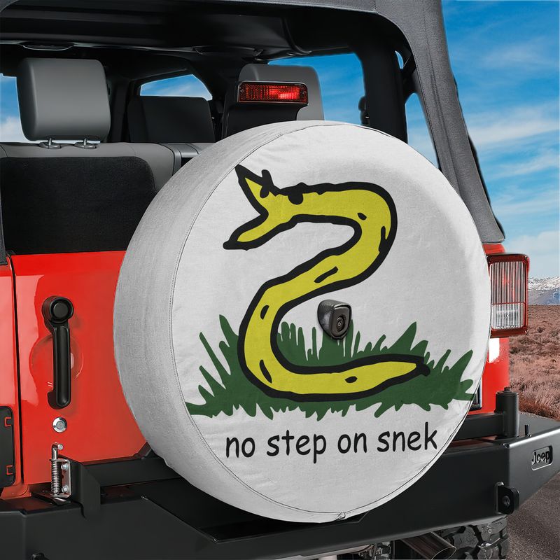 No Step On Snek spare tire cover with cartoon Gadsden snake meme and center camera hole