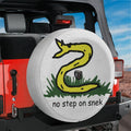 No Step On Snek spare tire cover with cartoon Gadsden snake meme and center camera hole
