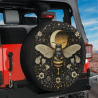 Celestial Buzz bee tire cover installed on a red Jeep Wrangler hatch with mystic moon, stars and floral border