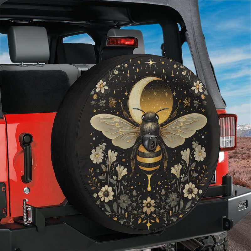 Celestial Buzz bee tire cover installed on a red Jeep Wrangler hatch with mystic moon, stars and floral border