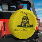 Gadsden Don't Tread on Me tire cover on red Jeep Wrangler with black coiled rattlesnake and bold lettering