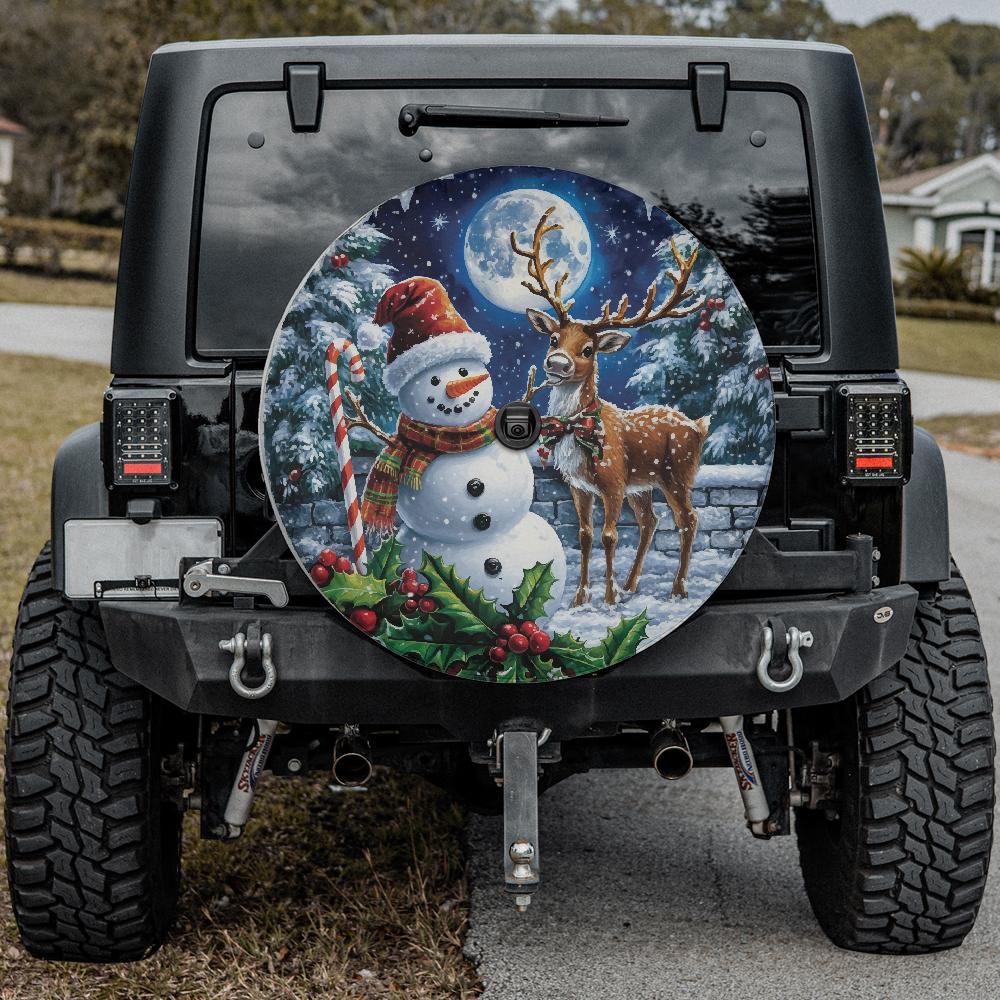 Snowman and reindeer holiday spare tire cover fitted on a black Jeep Wrangler with twin exhaust