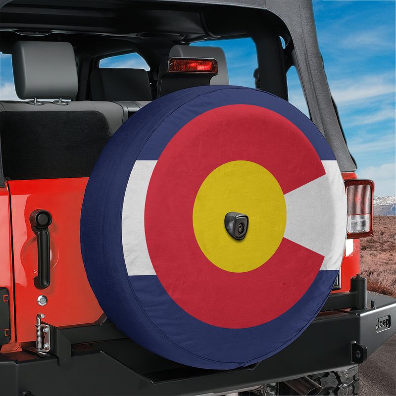 Colorado state flag spare tire cover studio shot showing blue white red bands and gold C with red disk