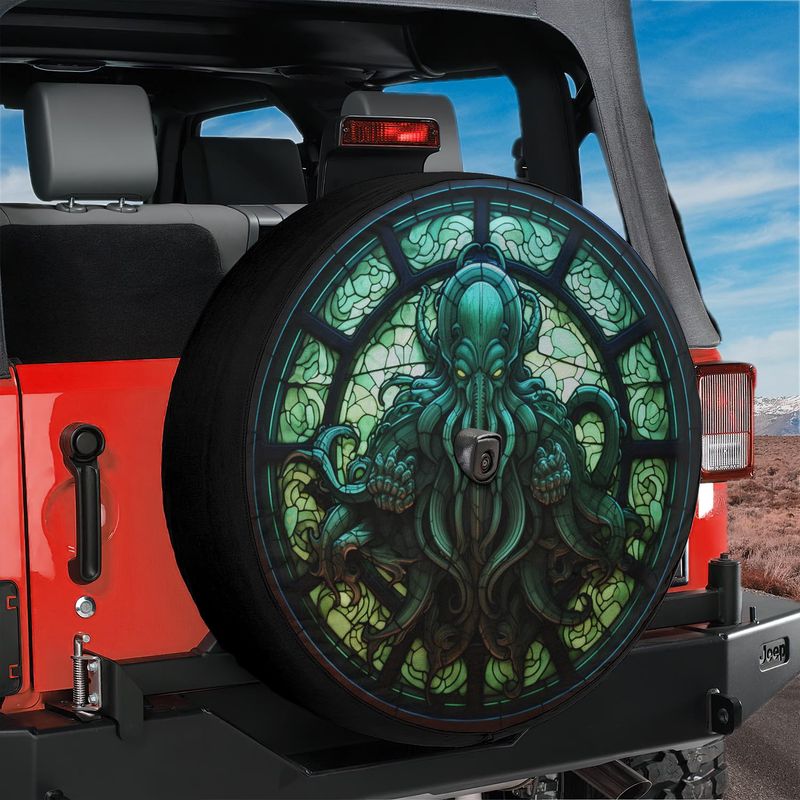 Cthulhu Rising stained glass spare tire cover mounted on a red Jeep Wrangler rear with green octopus deity art