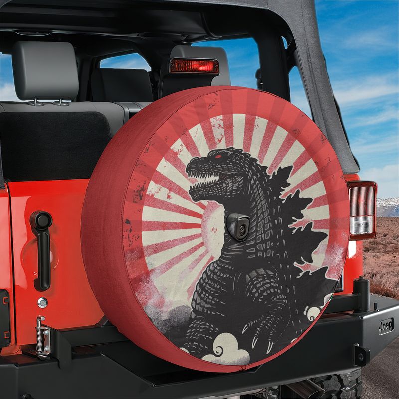 Kaiju Japanese sunburst spare tire cover on red Jeep Wrangler featuring snarling reptile creature