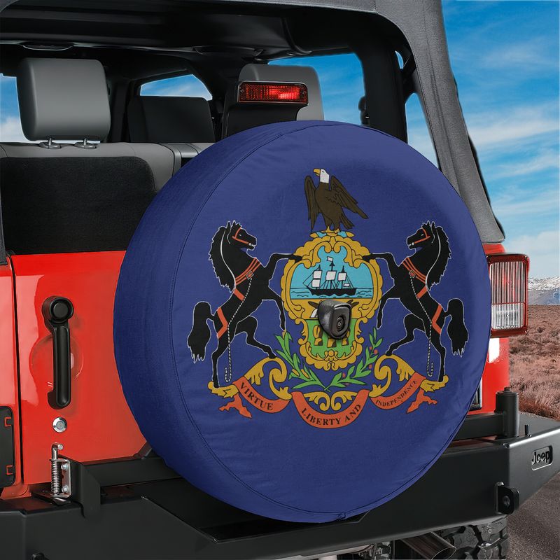 Pennsylvania state flag spare tire cover studio shot showing blue field with state coat of arms and camera cutout