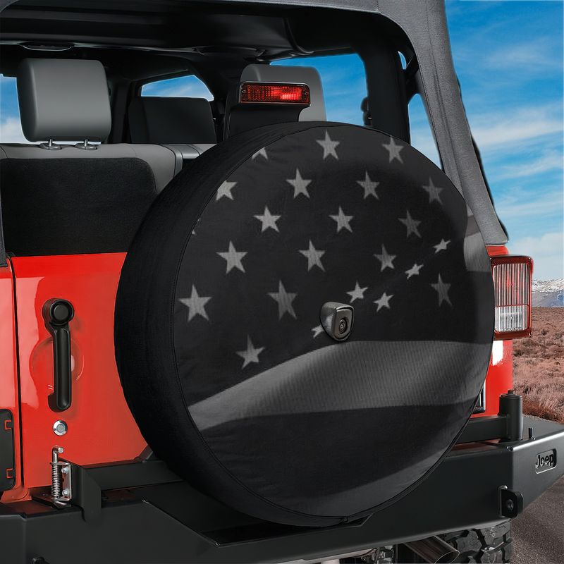 Wavey No Quarter American flag spare tire cover studio shot showing blacked-out flag with backup camera cutout