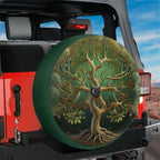 Yggdrasil ancient tree painted tire cover on red Jeep Wrangler with desert horizon and clear blue sky