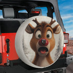 Red Jeep Wrangler displaying surprised Rudolph reindeer spare tire cover with rear backup camera hole