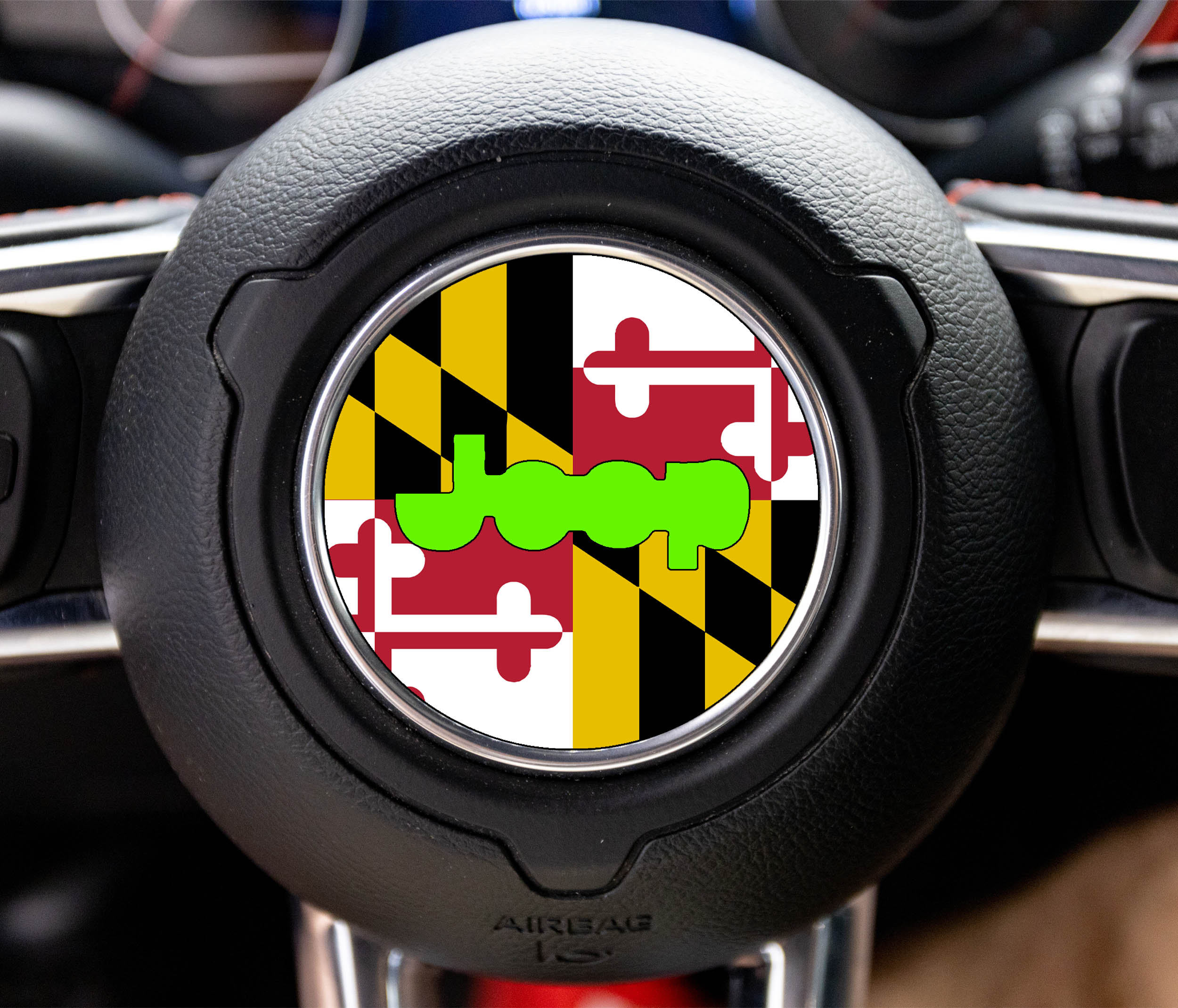 Maryland state flag center-cap overlay with gold-black checker, red-white cross, and lime-green Jeep wordmark
