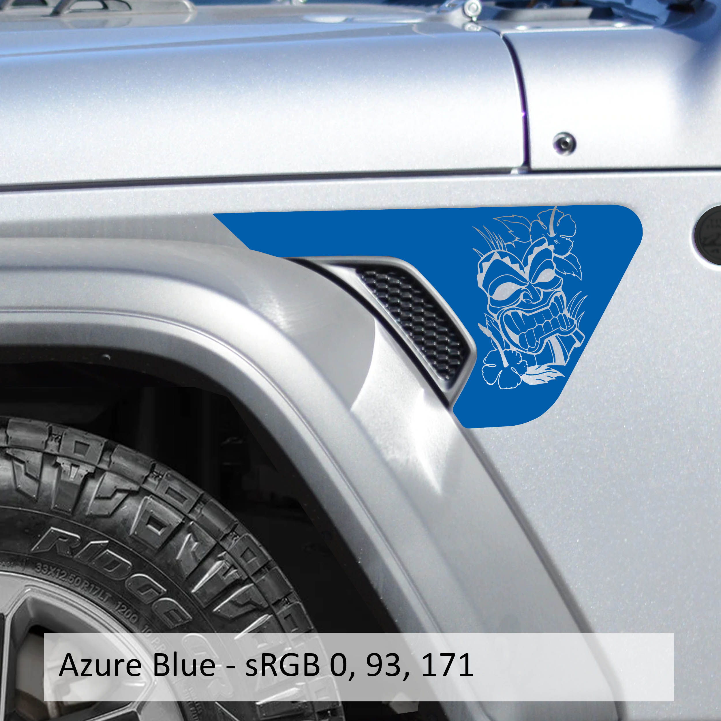 Azure blue Tiki Island Mask Jeep fender vent transfer decal applied to billet vent insert close-up view